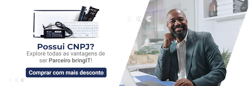 Banner bringIT convidando clientes com CNPJ a explorarem vantagens de ser parceiro para comprar com mais desconto. A imagem mostra componentes como tela, teclado, bateria e fonte de notebook ao lado de um profissional sorridente.
